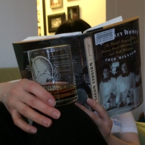 A photo of the blogger reading Fred Minnick's WHISKEY WOMEN with a dram of whisky in hand